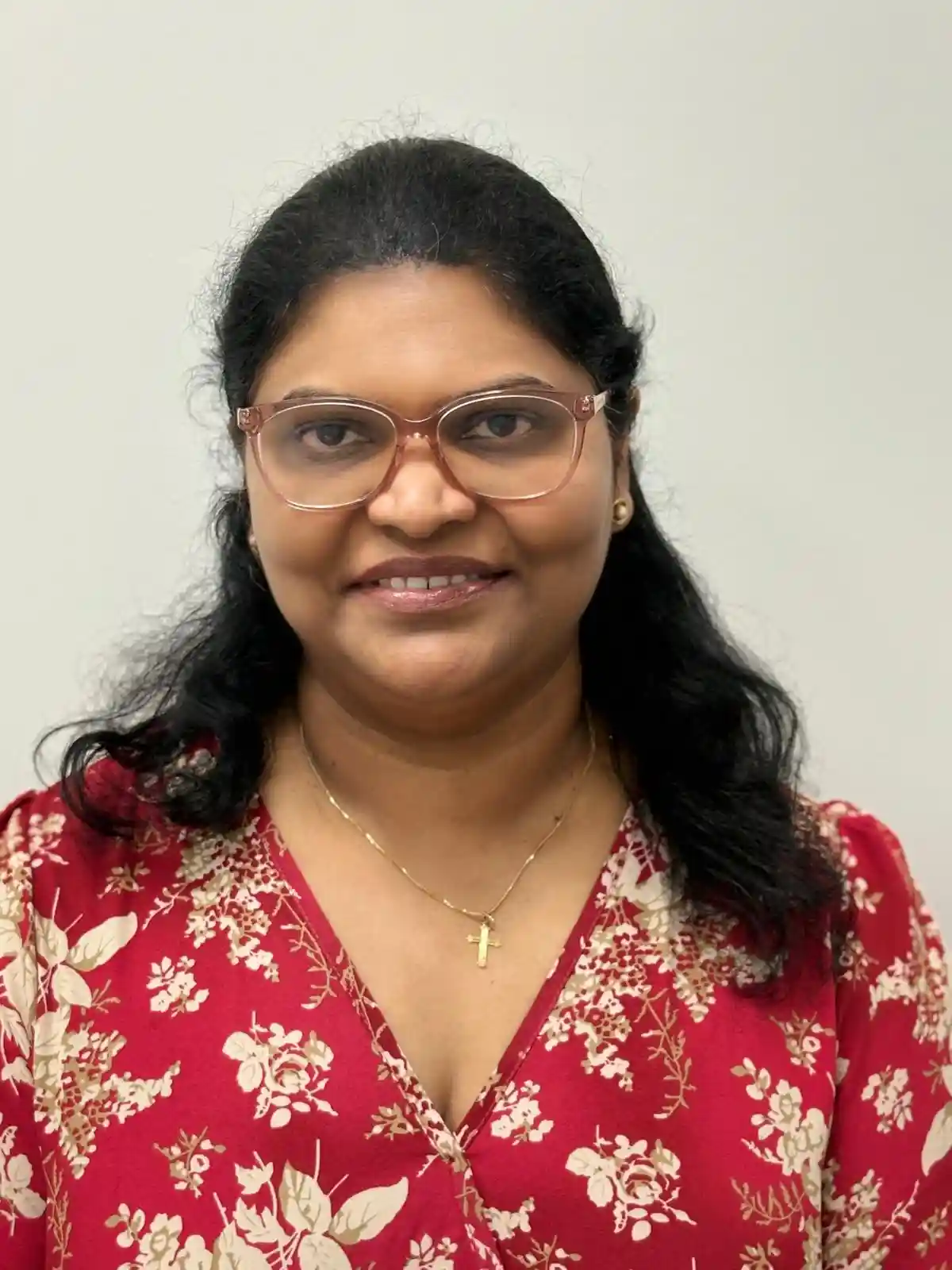 Thoughtful woman wearing a hijab looking out the window