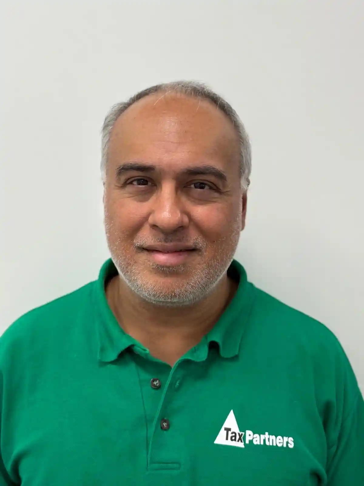 Bearded businessman having a phone call in a modern workspace