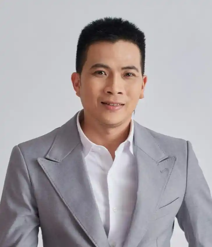 Casual man reading a book in a modern library setting